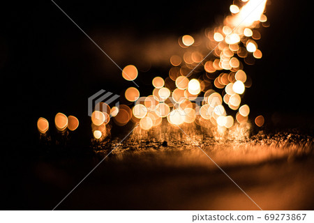 Glittering bokeh of hand-held fireworks 69273867