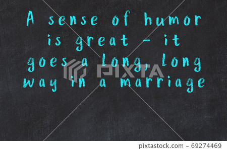 Chalk inscription of smart quote on black desk 69274469