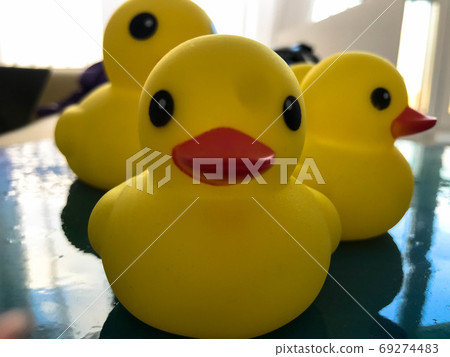Cute yellow rubber duck with a bright red beak 69274483