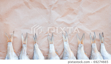 Dried fishes template banner on craft paper background with empty space for text. Flat Salted roach web cover backdrop. Seafood snack poster, flyer decorative design. Fish frame for promotion shop Dried fishes template banner on craft paper background with empty space for text. Flat Salted roach web cover backdrop. Seafood snack poster, flyer decorative design. Fish frame for promotion shop 69274665