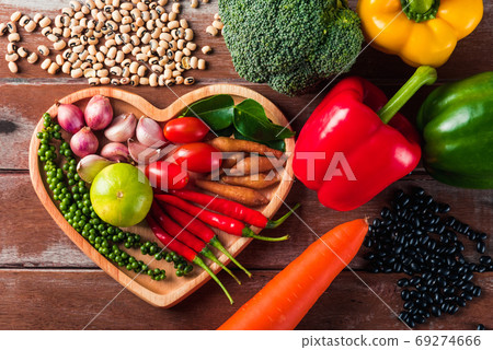 fresh organic fruit and vegetable in heart plate with copy space 69274666