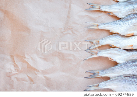 Dried fishes template banner on craft paper background with empty space for text. Flat Salted roach web cover backdrop. Seafood snack poster, flyer decorative design. Fish frame for promotion shop 69274689