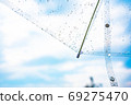Umbrella and sky after the rain 69275470