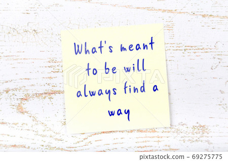 Wise quote on sticky note on wooden wall  69275775