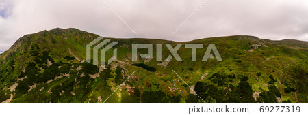 Carpathian lake Brebeneskul and rocky terrain near it, an attractive place for tourism, the highest lake of the Ukrainian Carpathians on the Montenegrin ridge. 69277319