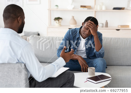 Psychotherapy Concept. Depressed black man talking to psychologist during individual therapy 69277955