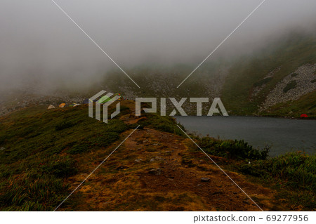 One of the Carpathian peaks is Gutyn Tomnatyk, a picturesque place near Lake Brebeneskul, a rocky mountain, a mountain of the Montenegrin ridge. One of the Carpathian peaks is Gutyn Tomnatyk, a picturesque place near Lake Brebeneskul, a rocky mountain, a mountain of the Montenegrin ridge. 69277956