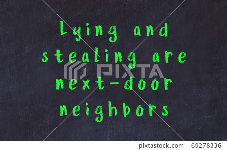 Chalk inscription of smart quote on black desk Chalk inscription of smart quote on black desk 69278336