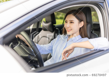 Asian female driver smile 69278497
