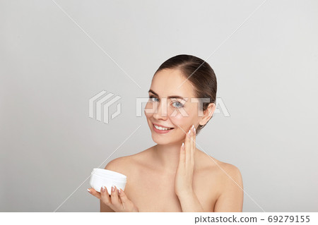 Woman Cleaning Face With White Pad. Woman Cleaning Face With White Pad. 69279155