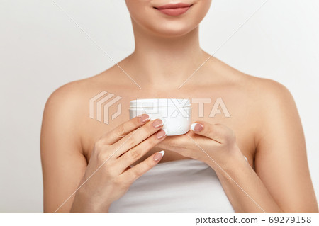 Woman Cleaning Face With White Pad. Woman Cleaning Face With White Pad. 69279158