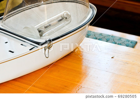 A large white disassembled street lamp A large white disassembled street lamp 69280505