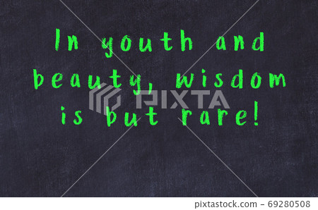 Black chalkboard with wise inscription on it 69280508