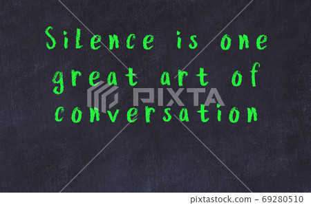 Chalk inscription of smart quote on black desk 69280510