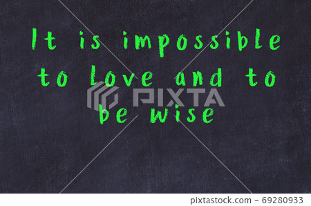Black chalkboard with wise inscription on it Black chalkboard with wise inscription on it 69280933