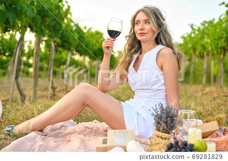 Woman smelling wine aroma taste. Happy girl drinking wine. Beauty lady with a glass of wine dreamy Woman smelling wine aroma taste. Happy girl drinking wine. Beauty lady with a glass of wine dreamy 69281829