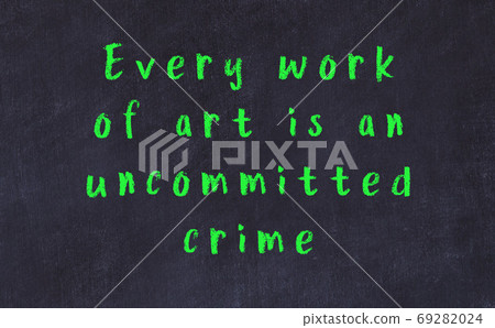 Chalk inscription of smart quote on black desk Chalk inscription of smart quote on black desk 69282024