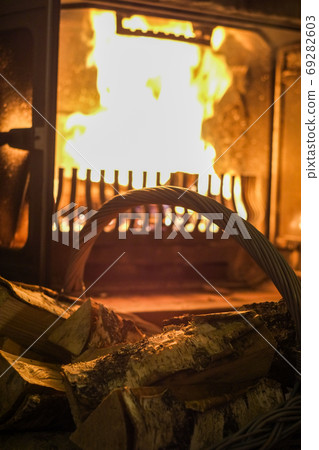 Wood and fireplace burning 69282603