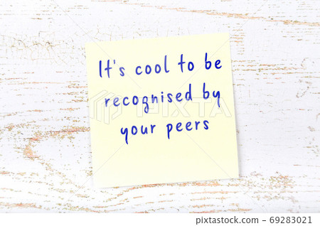 Wise quote on sticky note on wooden wall Wise quote on sticky note on wooden wall 69283021