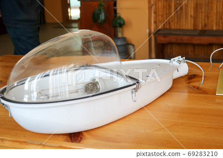 A large white disassembled street lam A large white disassembled street lam 69283210