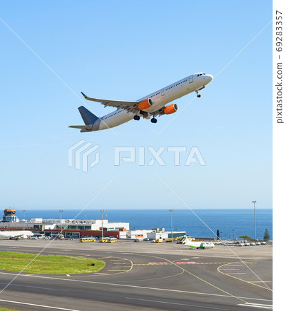 Airplane taking off, Madeira airport 69283357