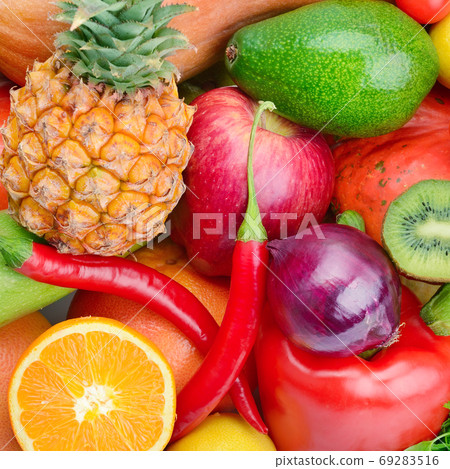 Assortment of vegetables and fruits. Bright background. Assortment of vegetables and fruits. Bright background. 69283516
