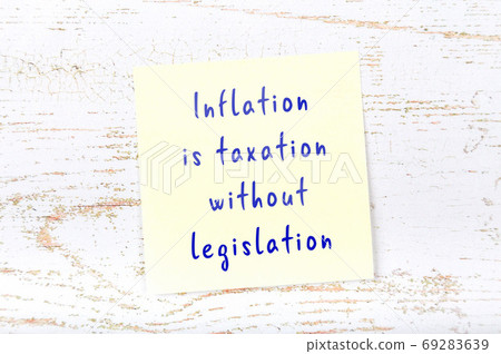 Wise quote on sticky note on wooden wall  69283639