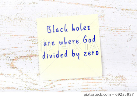 Wise quote on sticky note on wooden wall  69283957