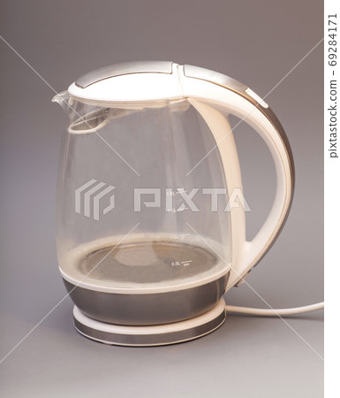 glass electric kettle isolated on gray background 69284171