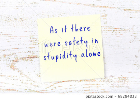 Wise quote on sticky note on wooden wall Wise quote on sticky note on wooden wall 69284838