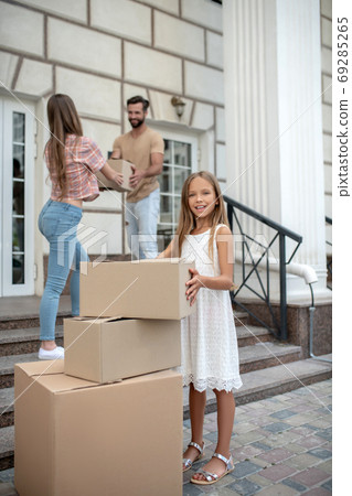 Young cute family moving to new home 69285265