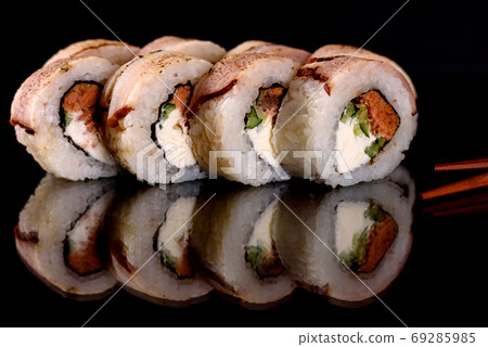Fresh sushi rolls prepared from the best varieties of fish and seafood Fresh sushi rolls prepared from the best varieties of fish and seafood 69285985