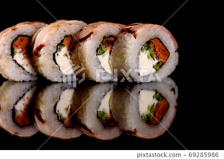 Fresh sushi rolls prepared from the best varieties of fish and seafood 69285986