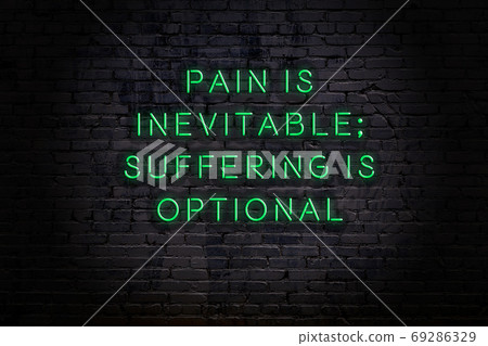 Wise quote. Neon inscription against brick wall Wise quote. Neon inscription against brick wall 69286329