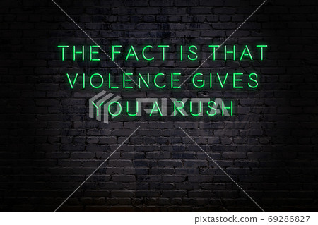 Wise quote. Neon inscription against brick wall 69286827