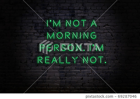 Wise quote. Neon inscription against brick wall Wise quote. Neon inscription against brick wall 69287046