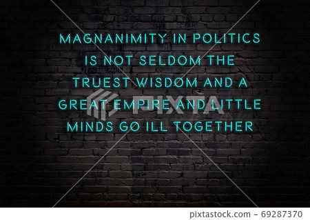 Wise quote. Neon inscription against brick wall Wise quote. Neon inscription against brick wall 69287370