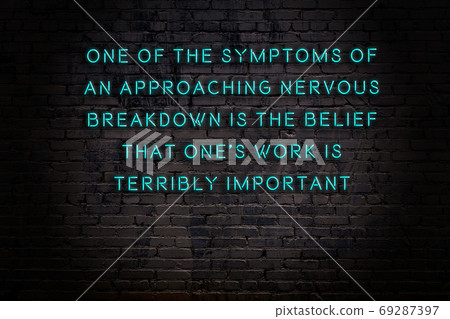 Wise quote. Neon inscription against brick wall 69287397