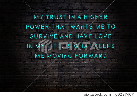 Wise quote. Neon inscription against brick wall Wise quote. Neon inscription against brick wall 69287407