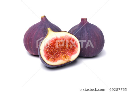 Two fresh figs and half isolated on white background Two fresh figs and half isolated on white background 69287765