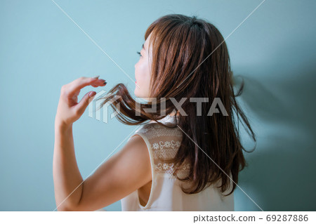 woman blowing her hair woman blowing her hair 69287886