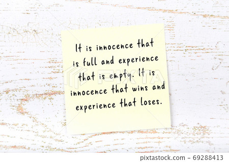 Yellow sticky note on wooden wall with wise quote Yellow sticky note on wooden wall with wise quote 69288413