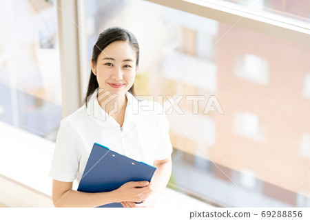 A smiling female nurse [portrait] 69288856