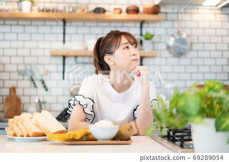 Young woman trying to perform a carb diet 69289054