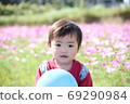 A child playing in a flower garden (cosmos) A child playing in a flower garden (cosmos) 69290984