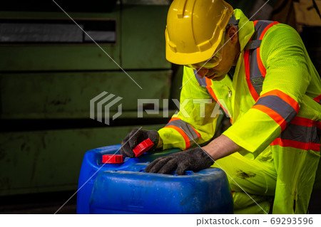 Engineer industry wearing safety uniform ,black gloves ,gas mask feel suffocate when under checking chemical tank in industry factory work Engineer industry wearing safety uniform ,black gloves ,gas mask feel suffocate when under checking chemical tank in industry factory work 69293596