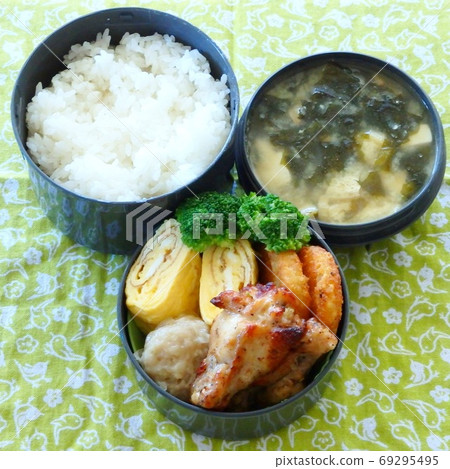 Handmade bento with egg, chicken and sushi on the side Handmade bento with egg, chicken and sushi on the side 69295495