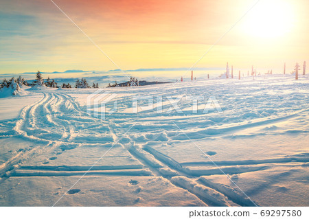Beautiful winter sunset landscape and road with covered snow Beautiful winter sunset landscape and road with covered snow 69297580