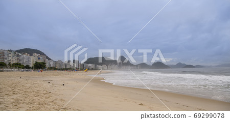 Rio de Janeiro, Brasil- February 28, 2020: Citizens swim and sunbathe on the beach of Copacabana Rio de Janeiro, Brasil- February 28, 2020: Citizens swim and sunbathe on the beach of Copacabana 69299078