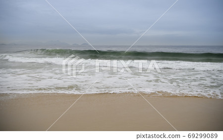 Rio de Janeiro, Brasil- February 28, 2020: Citizens swim and sunbathe on the beach of Copacabana Rio de Janeiro, Brasil- February 28, 2020: Citizens swim and sunbathe on the beach of Copacabana 69299089